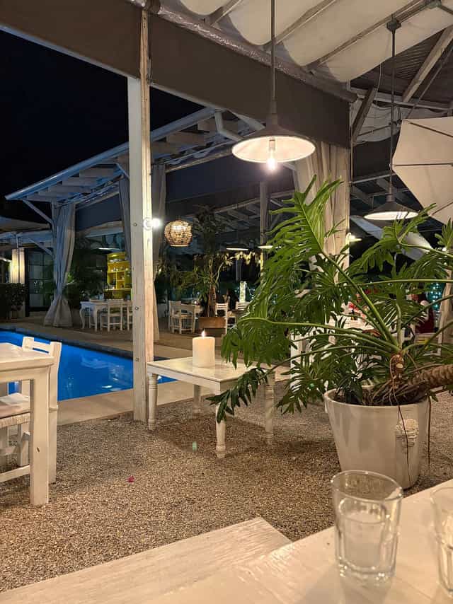 Poolside garden event venue at Las Casas Hotel with warm lighting, perfect for intimate receptions.