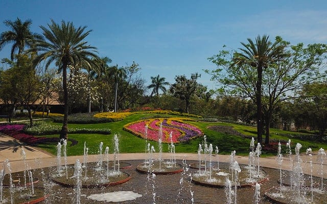 Luxury outdoor reception area at Salon Bamboo with lush scenic garden backdrop for events.