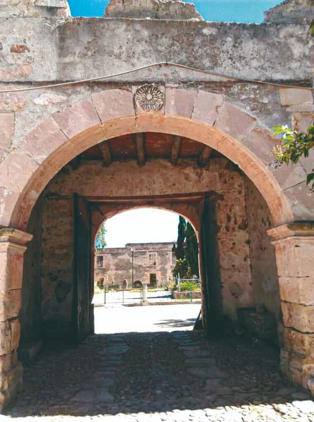 Historic stone archway entrance at Hacienda de San Nicolás for wedding or corporate event venue.