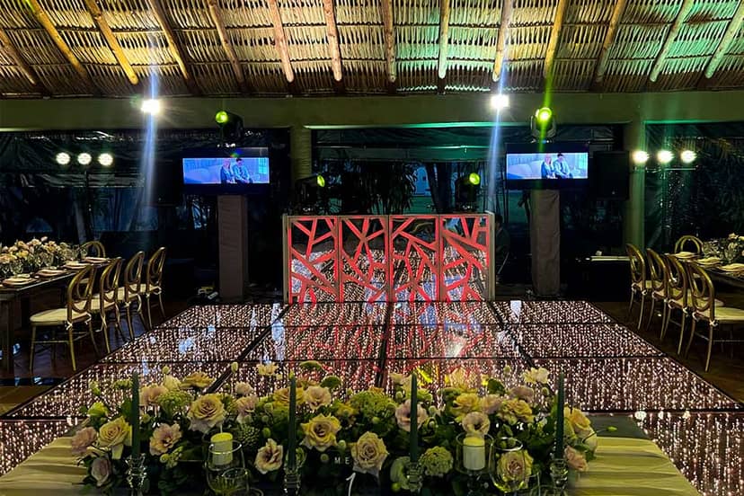 LED dance floor and custom DJ booth at Hacienda de San Nicolás wedding gala venue.
