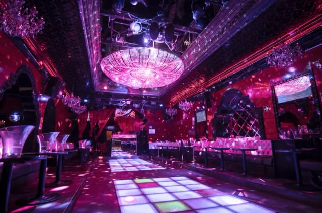 Function room at Rock L'Club with lighted dance floor for upscale corporate party events.