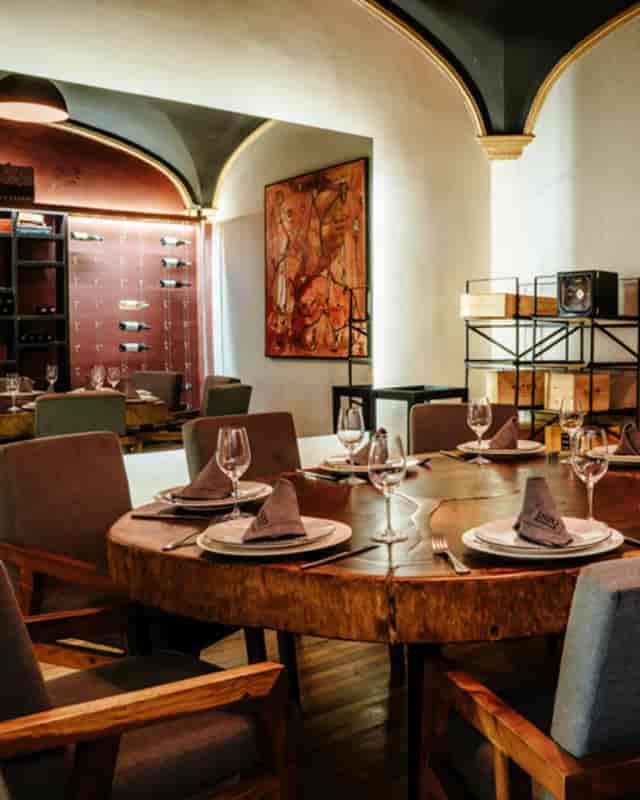 Private dining room with live-edge table for VIP dinners and corporate board meetings.