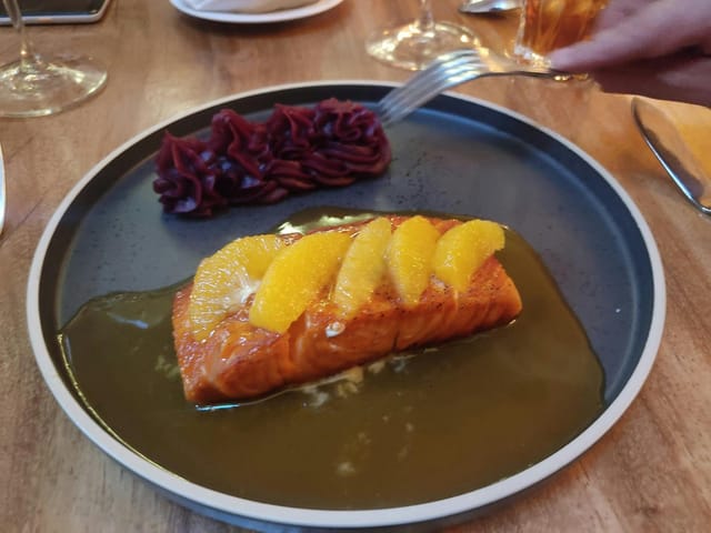 Gala salmon entrée with elevated plating, perfect for catering and formal event service.