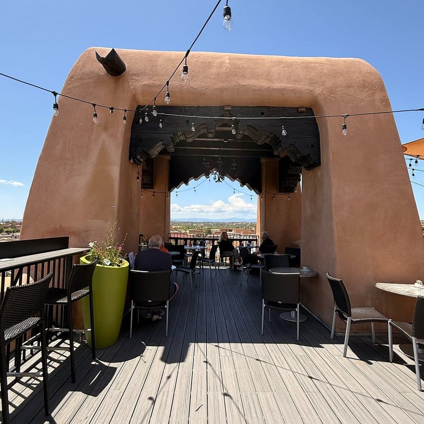 Bell Tower Bar rooftop with string lights for upscale networking reception and corporate events.