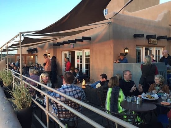 Bell Tower Bar outdoor reception area with fire features for corporate networking events.