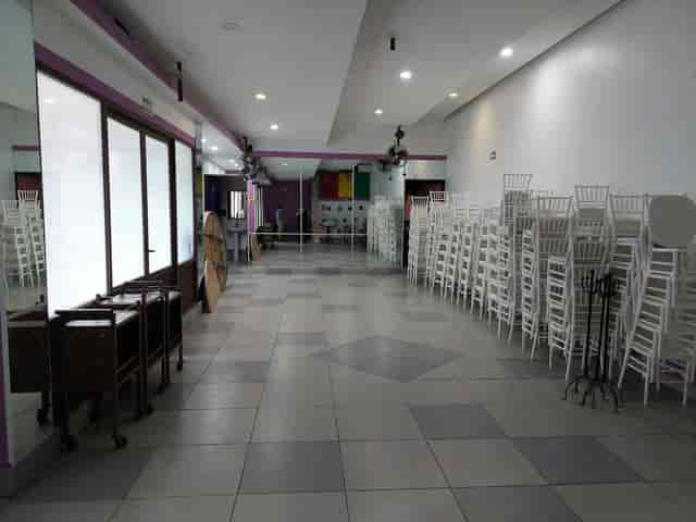 Salon Felix Cuevas event storage with stacked chairs for conference and wedding setup.