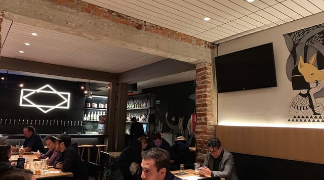 Industrial-chic restaurant bar for intimate team socials and networking events.
