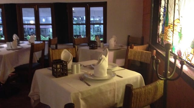 Rustic boardroom dining space for intimate private dinners and atmospheric corporate events.