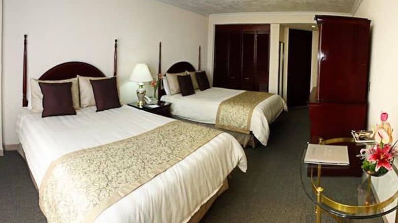 Standard double hotel room at Pedregal Palace, ideal for budget conference accommodation.