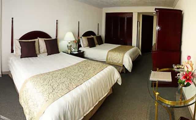 Standard double hotel room at Pedregal Palace for conference lodging and event accommodation.
