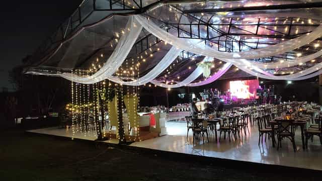Clear-top tent wedding reception at Hacienda la Esmeralda with fairy lights.