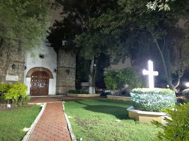 Historic outdoor wedding venue at Jardín Lienzo Charro La Tapatía with lush garden lighting.