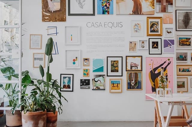 Modern art gallery venue at Casa Equis with gallery wall for networking and creative events.