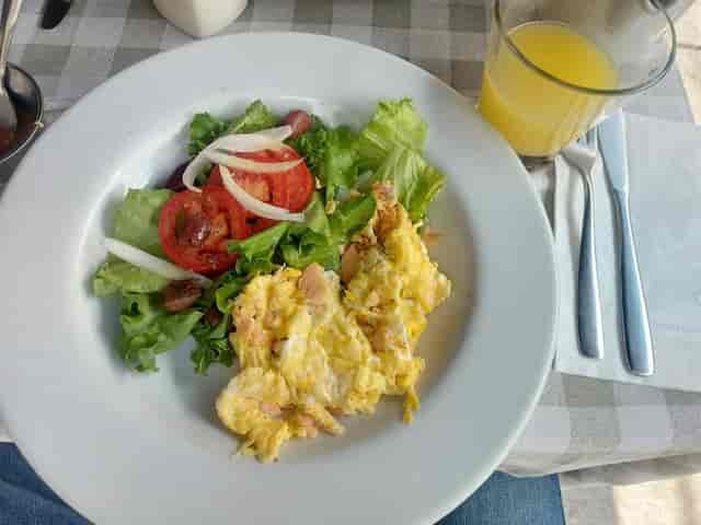 Scrambled eggs and salad breakfast buffet for corporate conference catering.