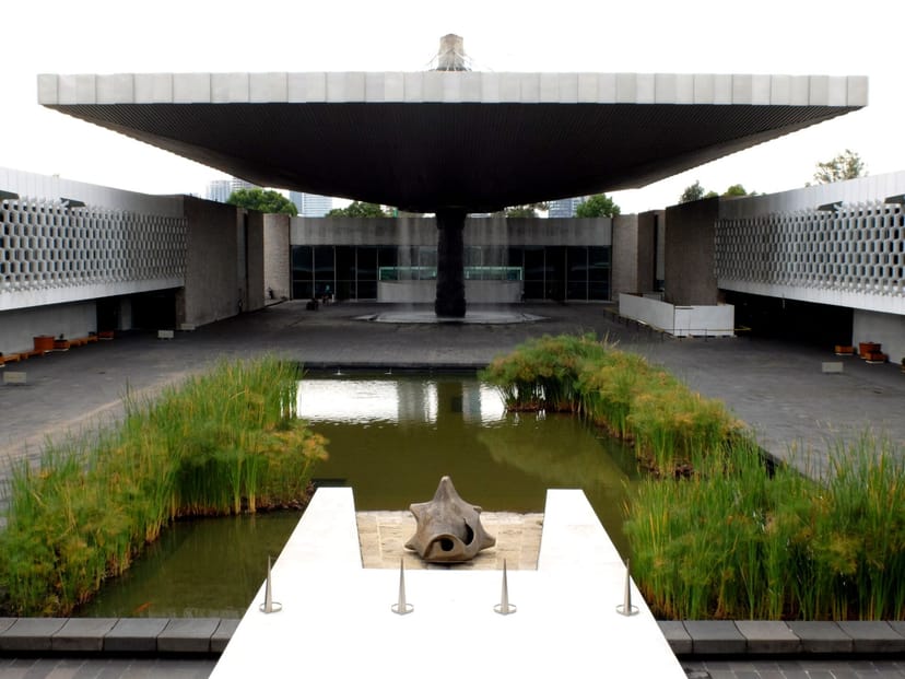 National Museum of Cartography exhibition hall with central water feature, event venue.