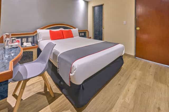 Superior double room at Hotel Monarca, affordable hotel accommodation for budget travel.