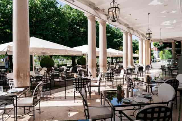 Elegant outdoor terrace at Café Beau-Rivage for corporate networking and upscale brunch events.