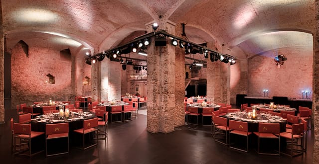 Event space at Fàbrica Moritz with industrial chic design for upscale meetings and banquets.