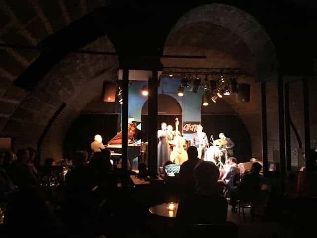 Jazz quartet performing at Chorus, Lausanne; vaulted venue for corporate events.