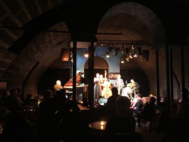 Jazz quartet performing at Chorus, Lausanne; vaulted venue for corporate events.