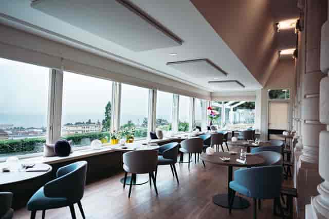 Luxury Lausanne Palace suite for corporate retreats and networking events with panoramic views.