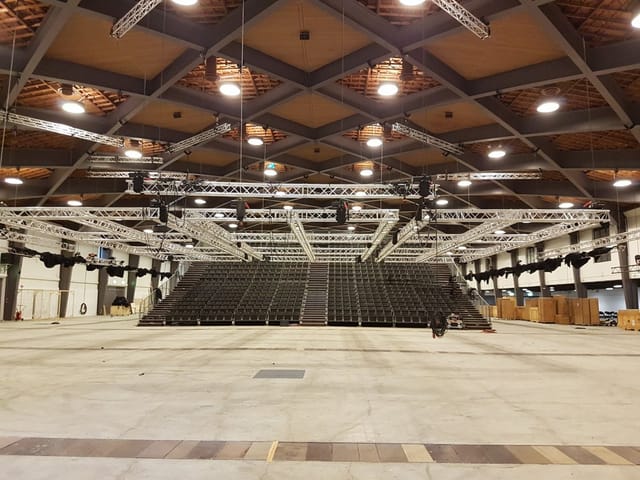 Beaulieu Lausanne convention space with overhead rigging for large-scale plenary events.