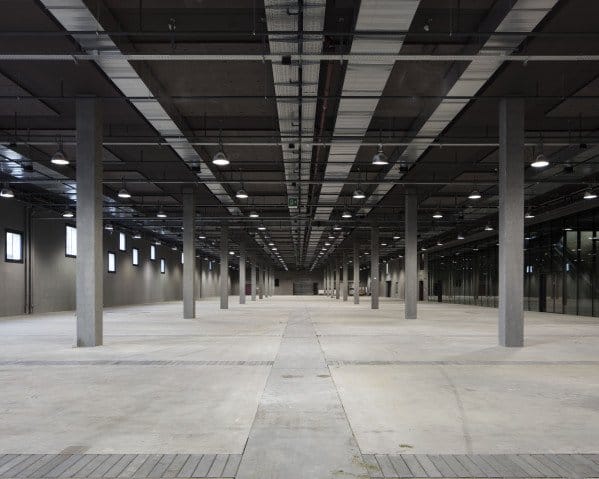 Halle 6-7 Beaulieu Lausanne: Industrial raw concrete venue for large-scale production events.
