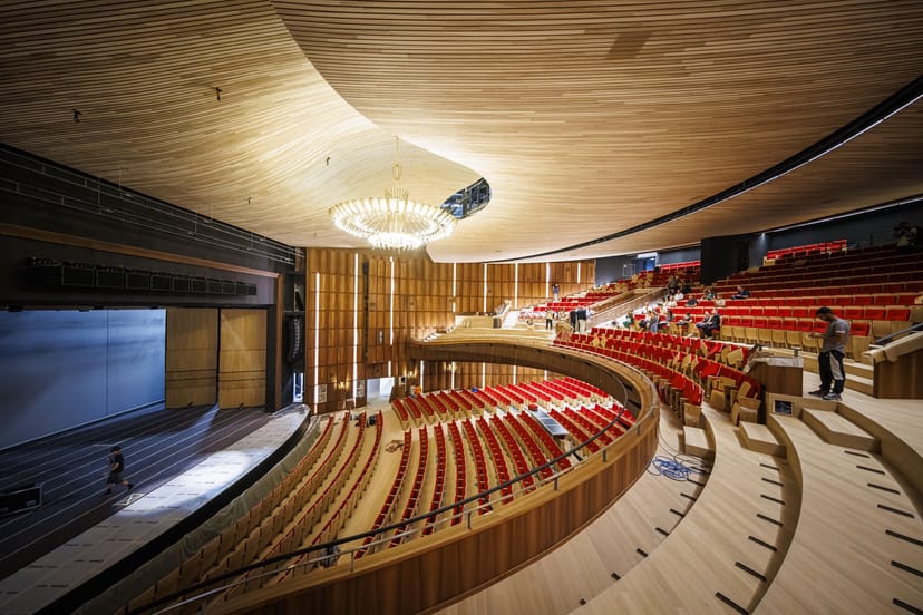 Modern auditorium at Theatre de Beaulieu, Lausanne, featuring acoustic wood for keynote events.