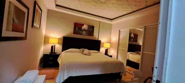 Suites del Valle hotel room: functional mid-scale accommodation for corporate or leisure travel.