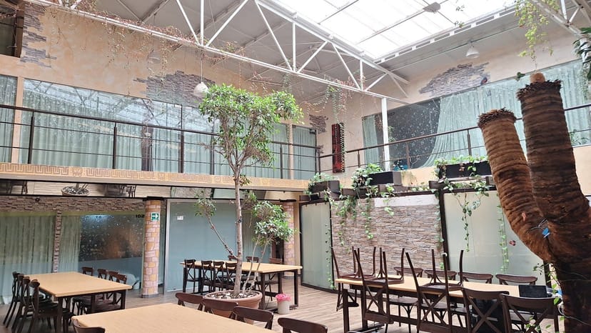 Industrial venue with mezzanine for corporate events and social mixers.
