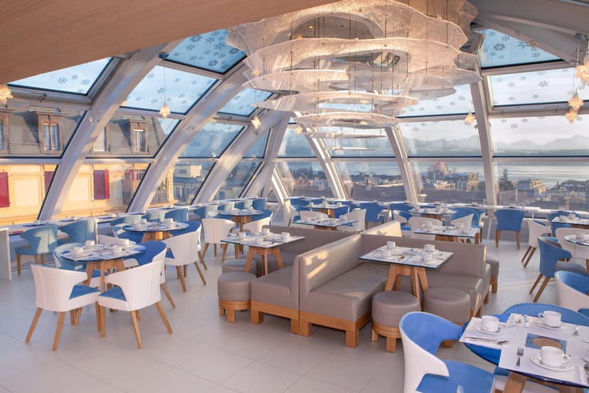 Sun-drenched lounge with glass ceiling, perfect for executive luncheons and VIP receptions.