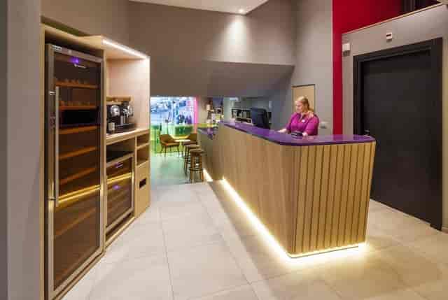 Modern hotel reception and networking space for corporate event delegate registration.