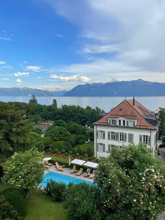 Le Lavaux venue at Hôtel Angleterre: luxury board retreat and wedding space with lake views.