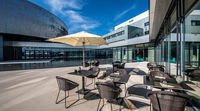 Modern outdoor terrace at Aquatis Hotel for corporate networking and professional cocktail events.