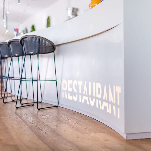 Modern Aquatis Hotel bar for networking events and corporate registration.