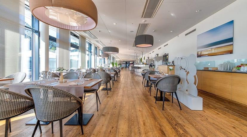 Modern hotel breakout space for corporate events and networking luncheons.