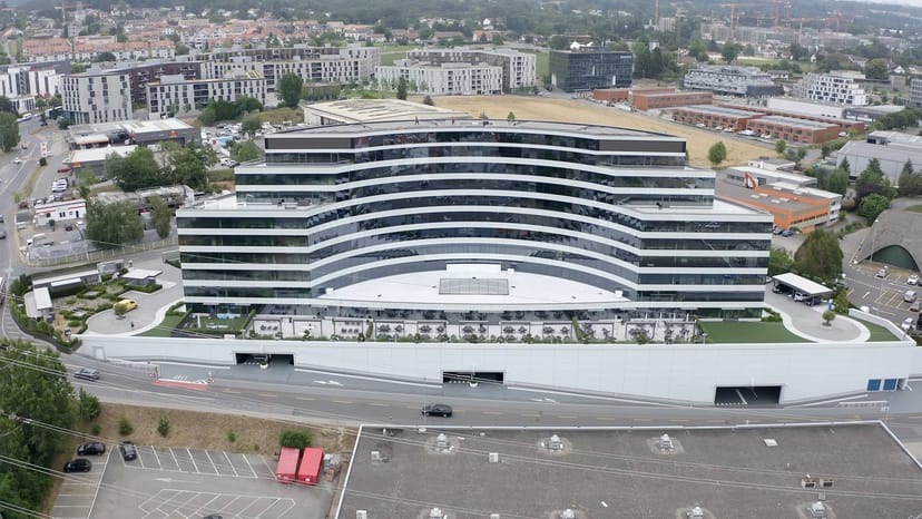 Modern curved conference center venue for corporate evening receptions and brand activations.