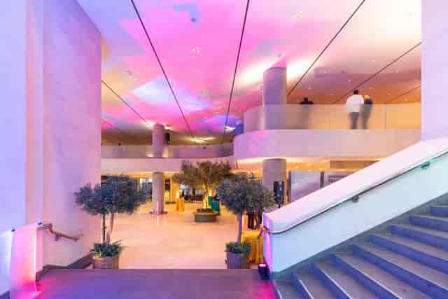 Sainsbury Wing Foyer, modern meeting space with greenery, perfect for professional events.