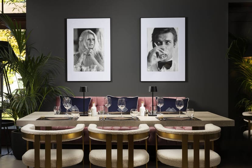 Sophisticated Jardin de Penthes restaurant with velvet seating for corporate and VIP events.
