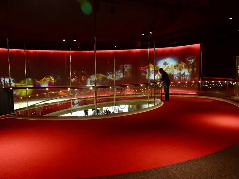 Curved projection wall in Olympic Museum Olympia Room for immersive brand events and receptions.