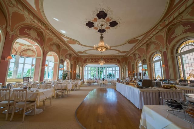 Opulent ballroom at Eden Palace au Lac, elegant buffet banquet setup for wedding or event venue.
