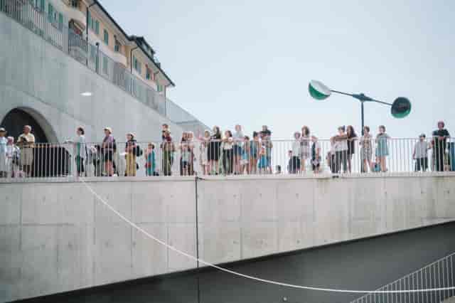 Event planner managing crowd flow at PLATEFORME 10 venue for outdoor event logistics.