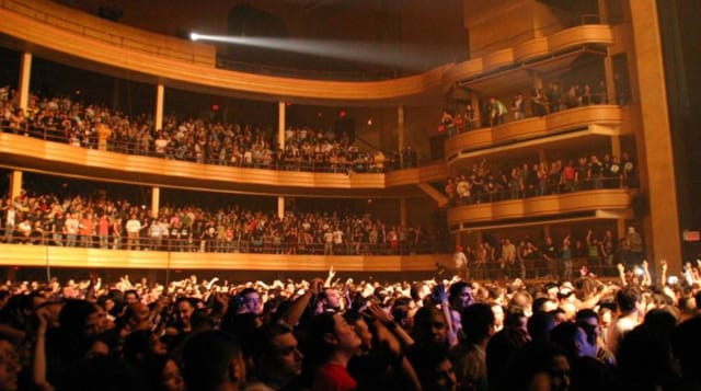 Packed Grand Ballroom in Manhattan Centre during a live performance, showcasing audience engagement.