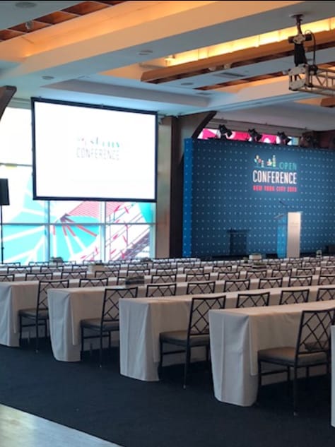 Pier Sixty classroom setup with branded backdrop for corporate conference and event venue.
