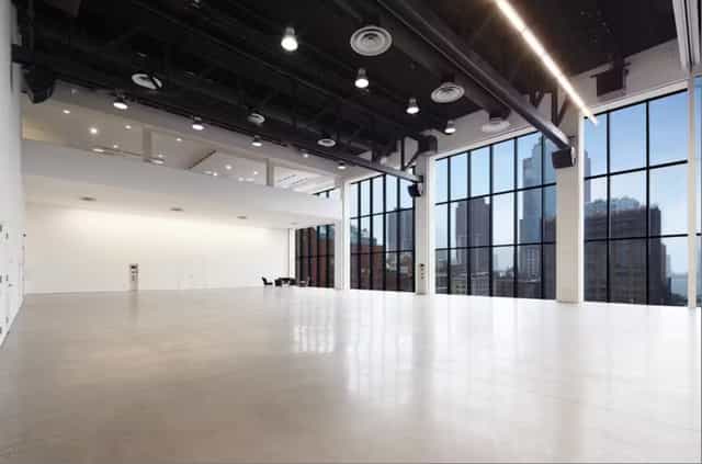 Spacious Spring Studios venue in NYC with large windows for events and city views.