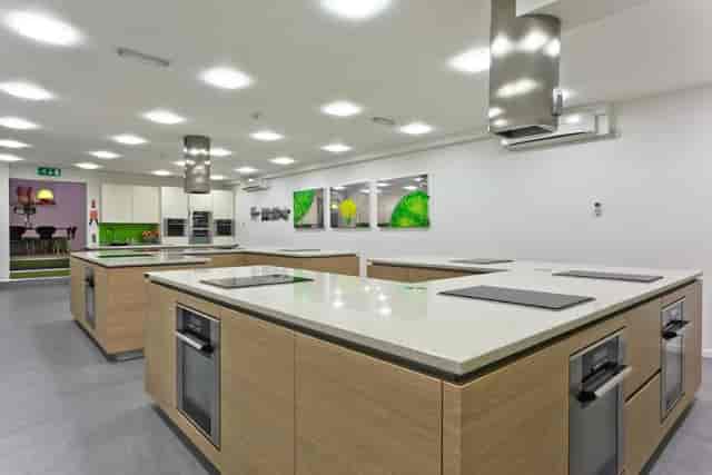 Modular development kitchen for corporate culinary workshops and team-building events.