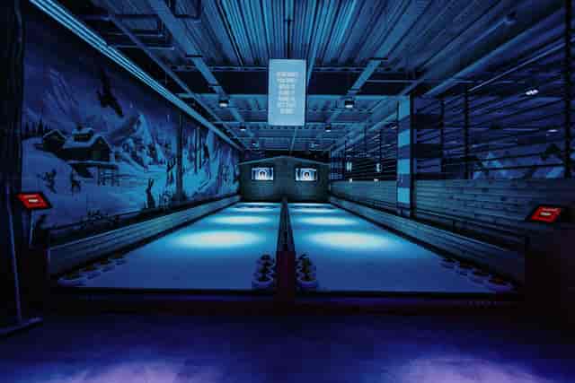 Indoor curling venue at The Lodge, ideal for team-building events in Cheltenham.