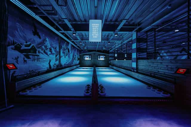 Indoor curling venue at The Lodge, ideal for team-building events in Cheltenham.