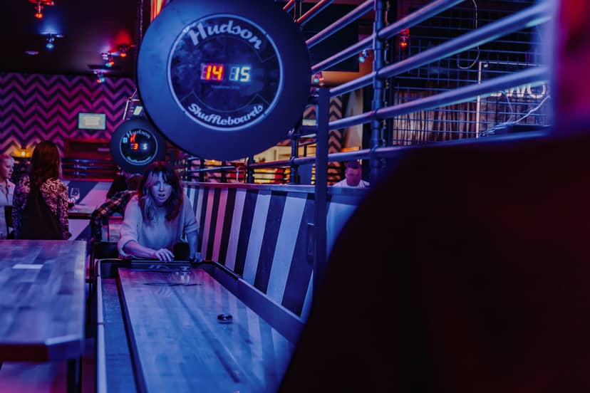 Roxy Lanes Tournament Area with shuffleboard, perfect for team-building and networking events.