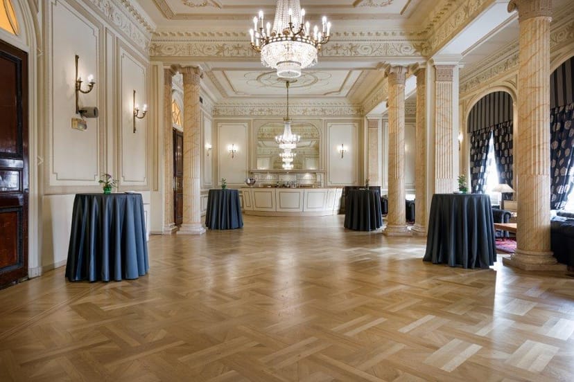Cocktail reception setup at Casino de Madrid ballroom with high-end cruiser tables.